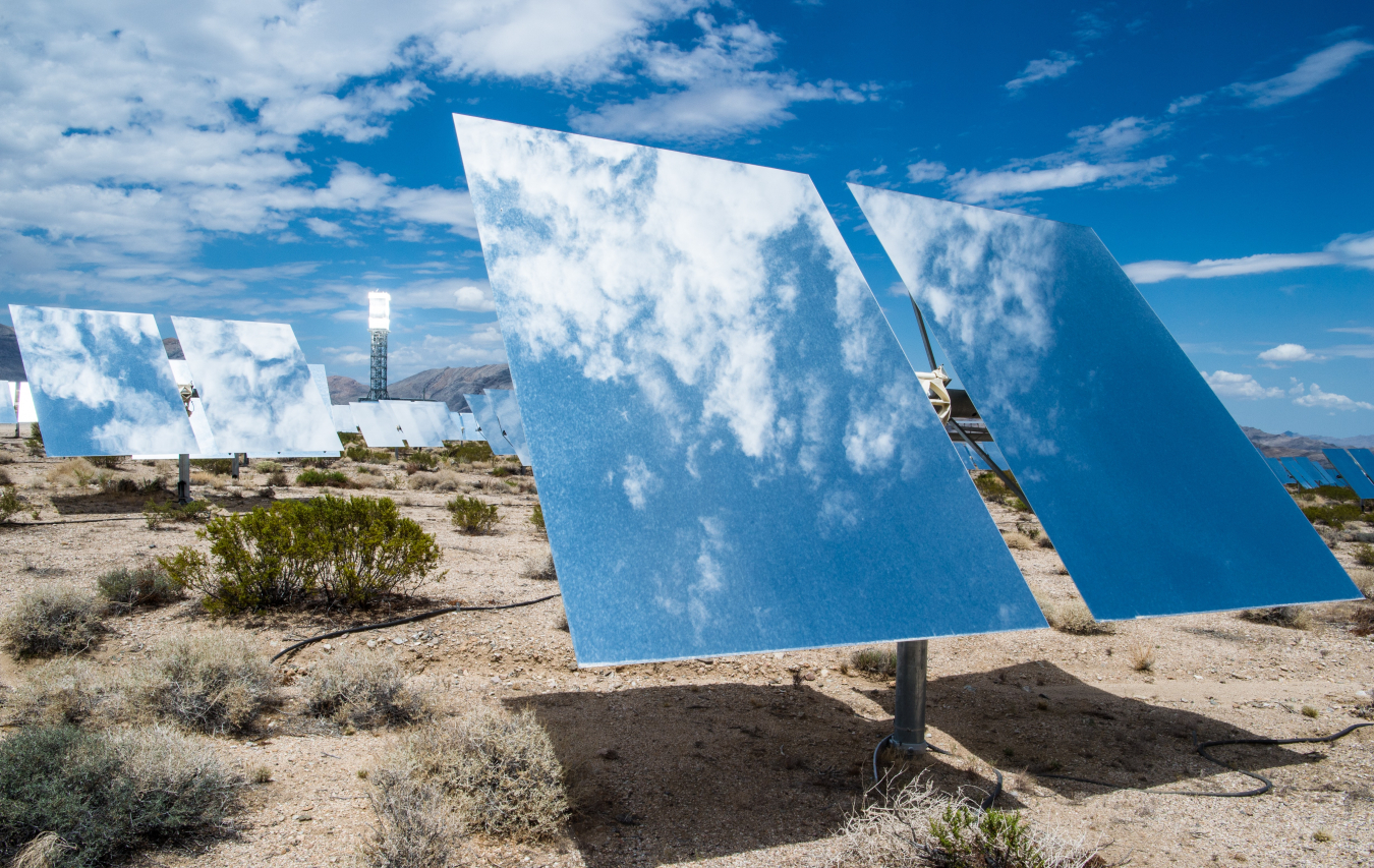 Heliostat mirror reflects sky and clouds