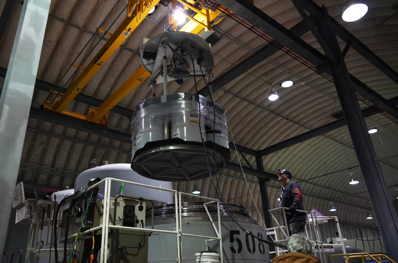 Oak Ridge employees load processed and repackaged waste for shipment