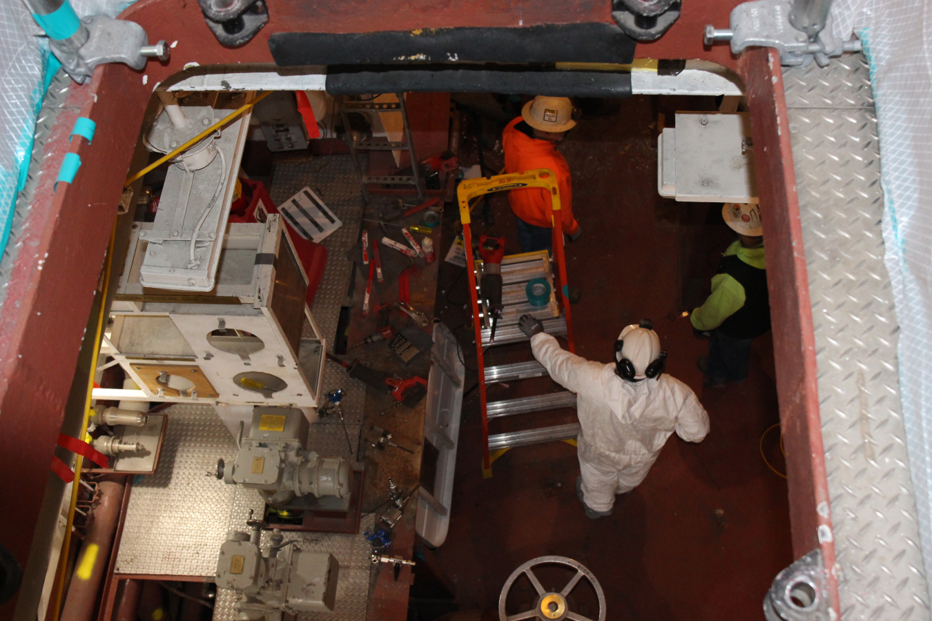 Crews working inside a room to deactivate a building