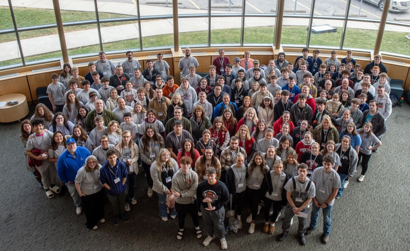 An aerial view of a large group of students who participated in a science bowl competition