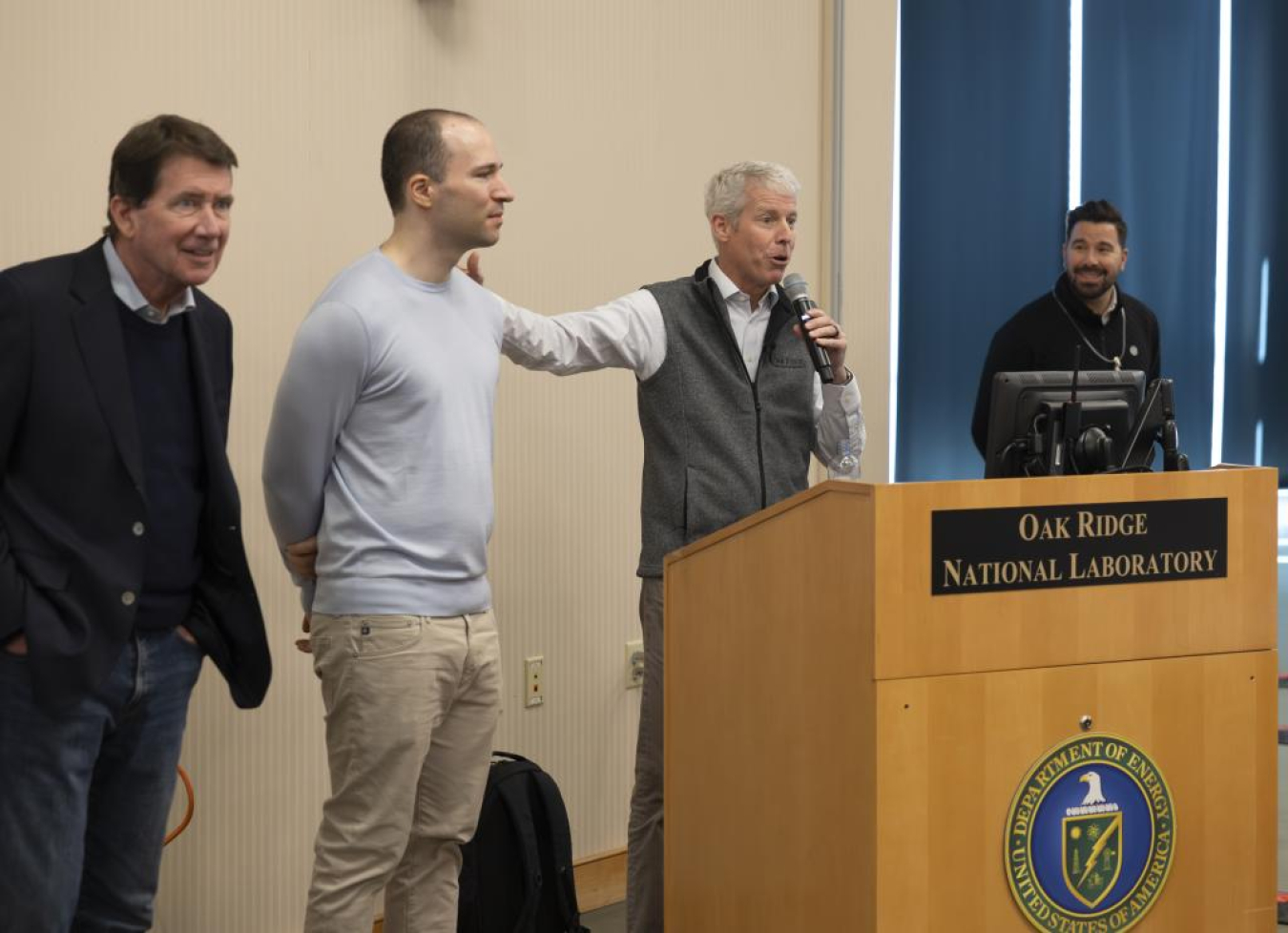 Secretary Wright addresses participants in the “1,000 Scientists AI Jam Session,” along with OpenAI co-founder Greg Brockman and U.S. Sen. Bill Hagerty.