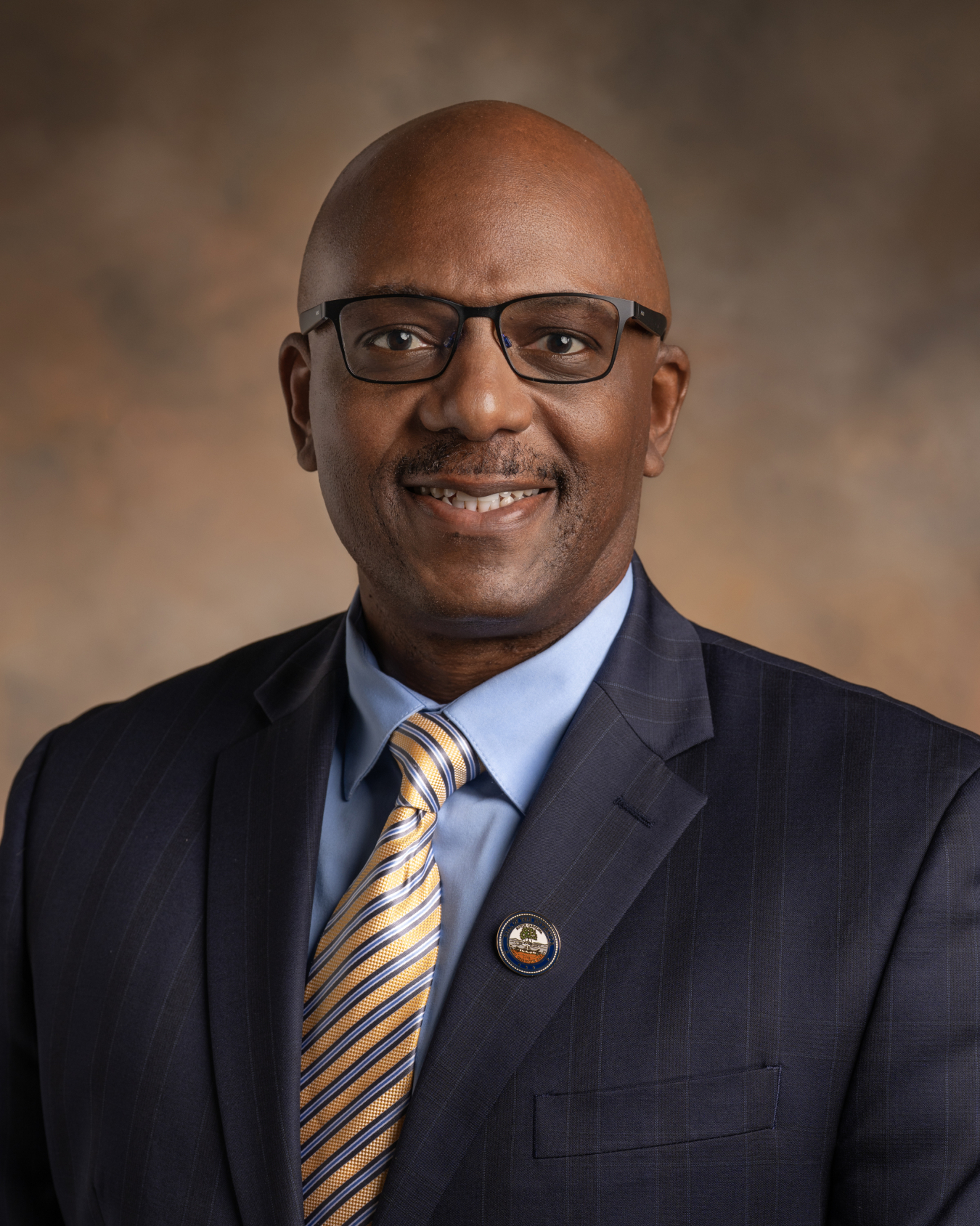 Portrait of a man in glasses and a suit