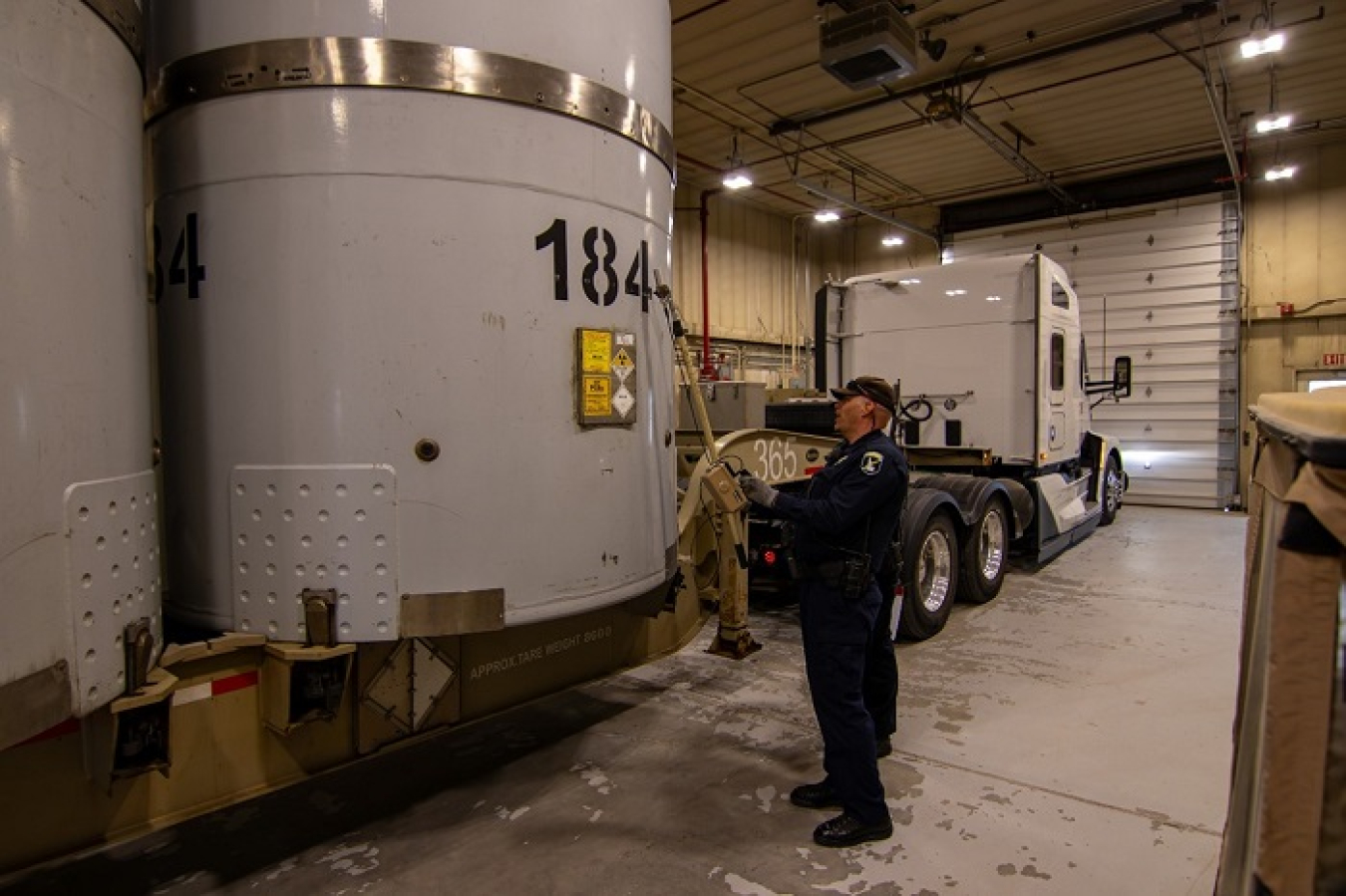 An Idaho State Police officer inspects the Idaho Cleanup Project’s shipment of transuranic waste.