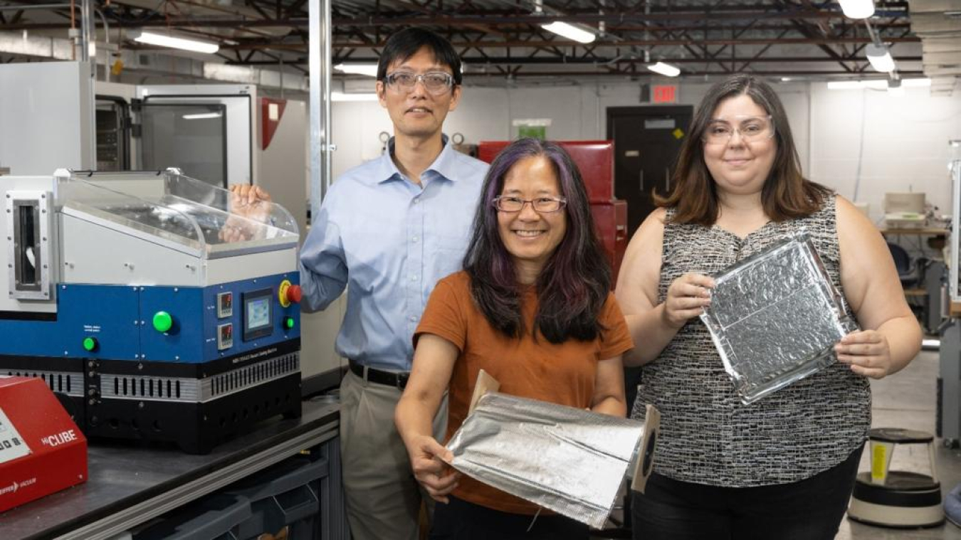 ORNL researchers demonstrate the self-healing barrier film that was licensed by Flexcon to incorporate into vacuum insulation panels. 