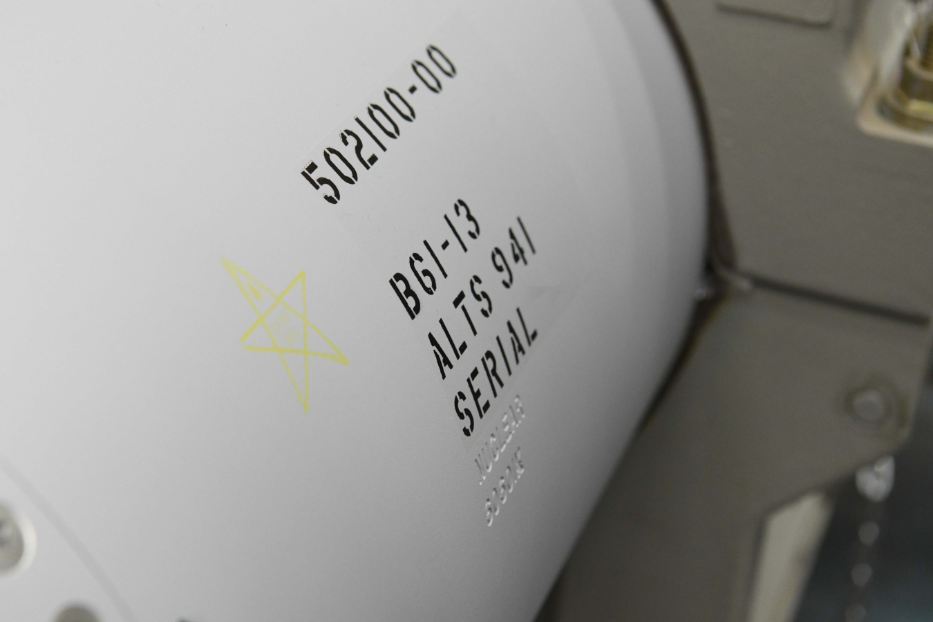 A star stamp and printed letters on the surface of the B61-13