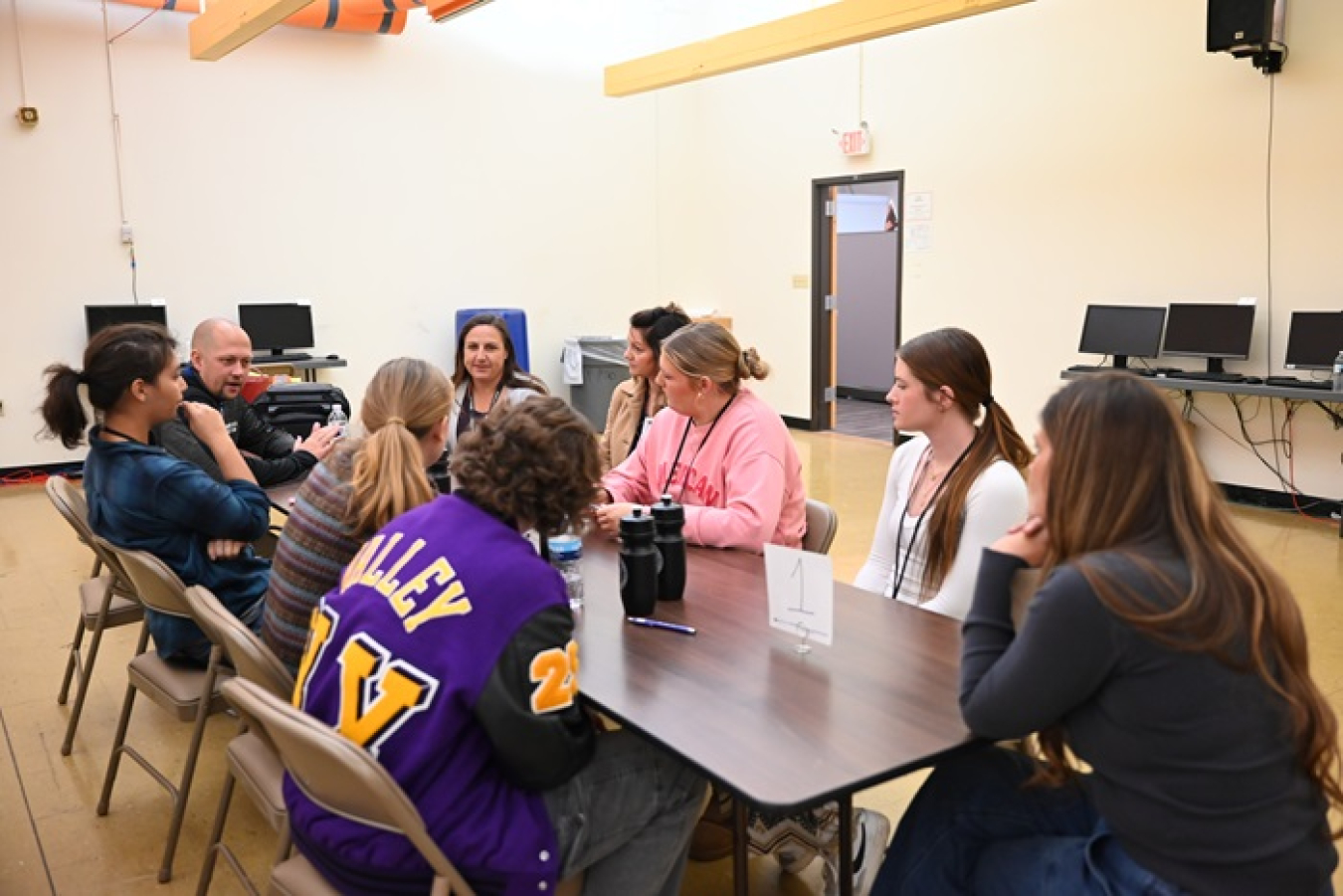 Students from Valley High School sit a table with Portsmouth Site contractors to discuss cleanup projects, potential careers and educational requirements.