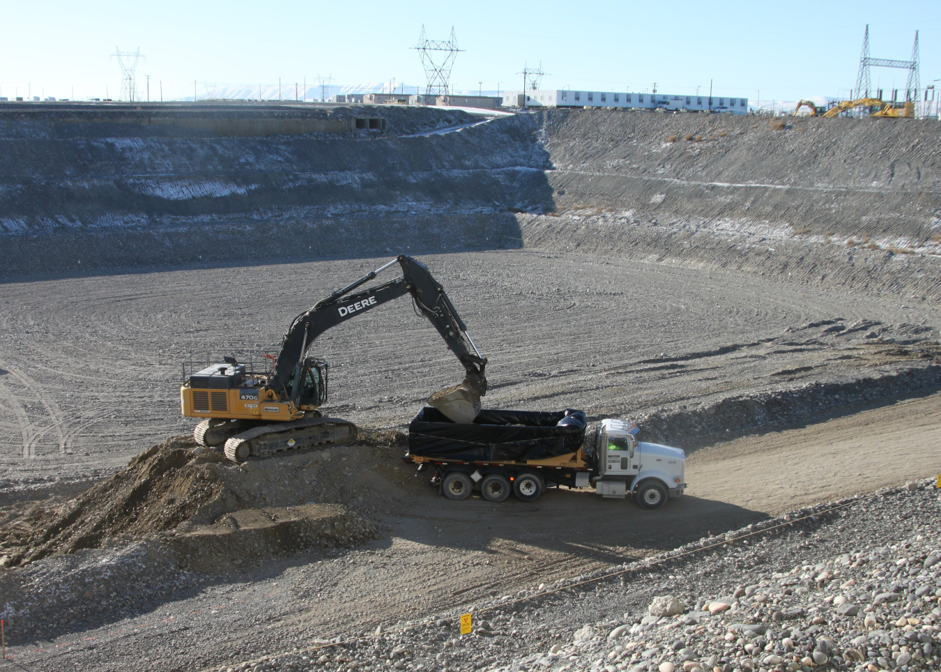 Work vehicles work to clear an area on the Hanford Site