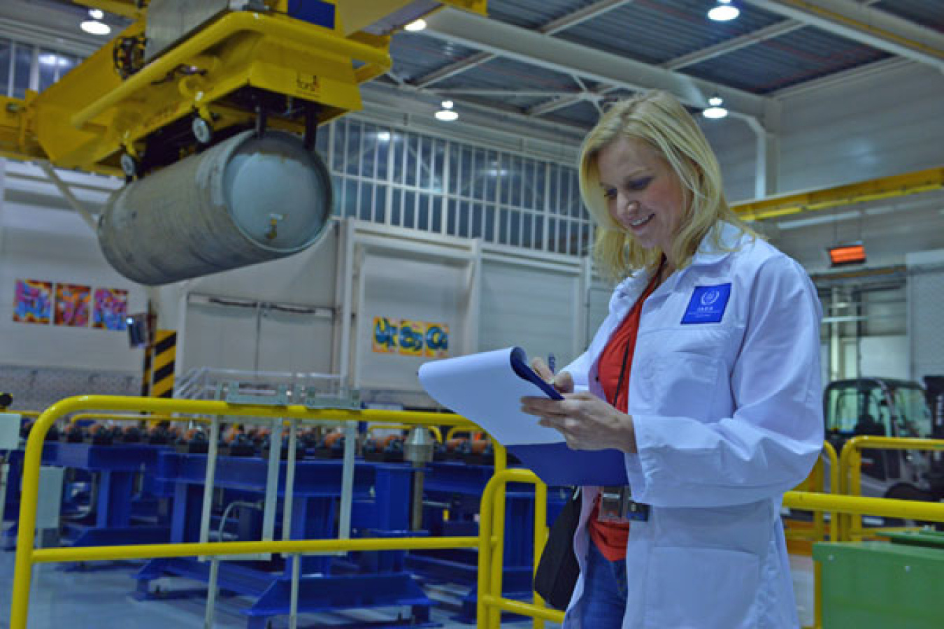 A nuclear inspector looks at a clipboard
