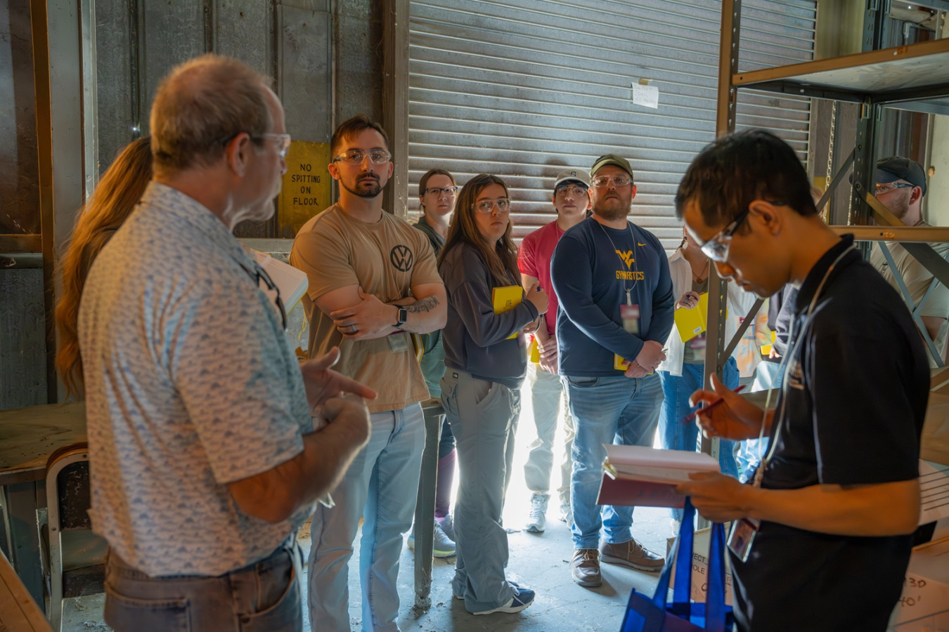 A group of people inside a rock library at the Savannah River Site