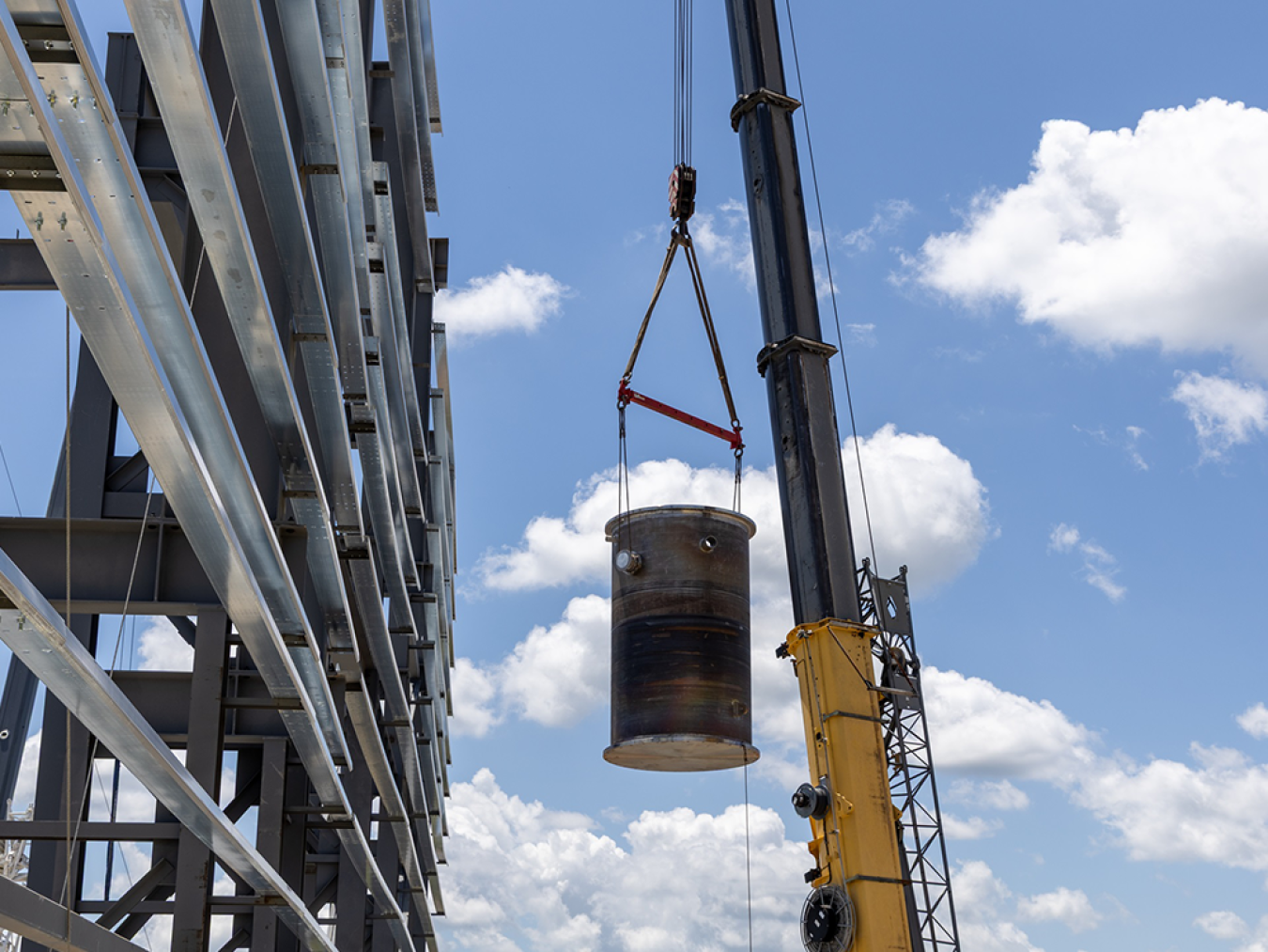 Engineering Test Unit 3.0 reactor vessel being carried by a crane.