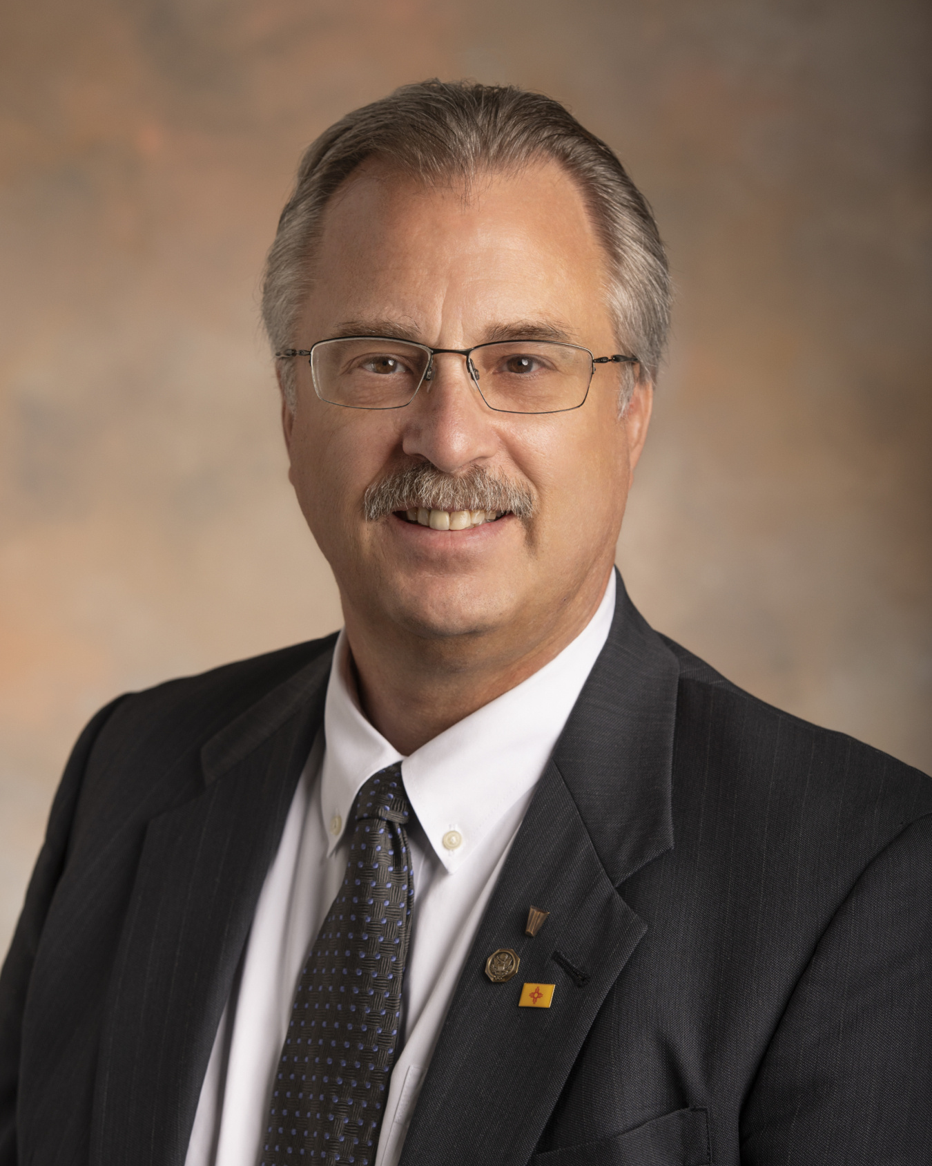 A portrait of Michael Mikolanis