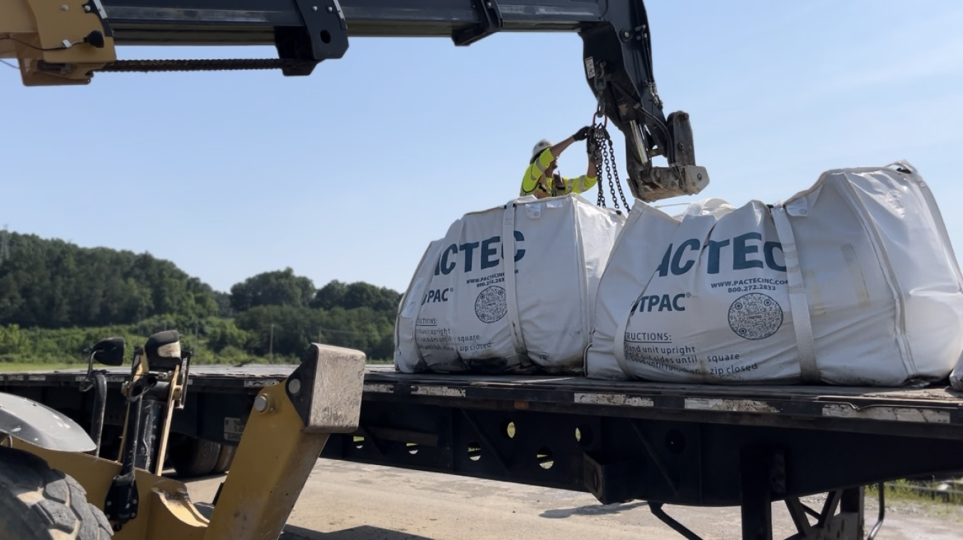 Lead and copper in recycling bags being loaded onto a truck