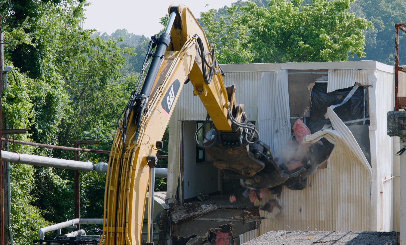 A crane demolishing a building 