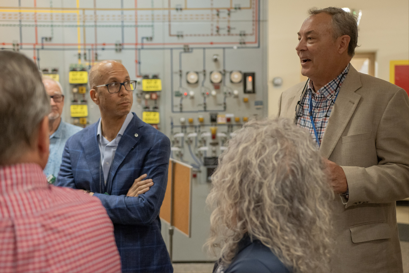 The PPPO site manager gives a tour to a group of people