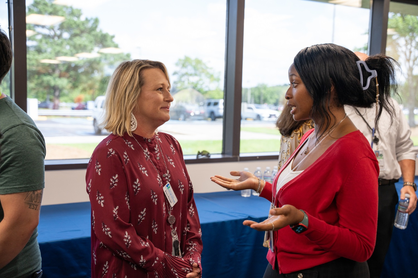 Two women speaking to each other at an intern meet and greet event