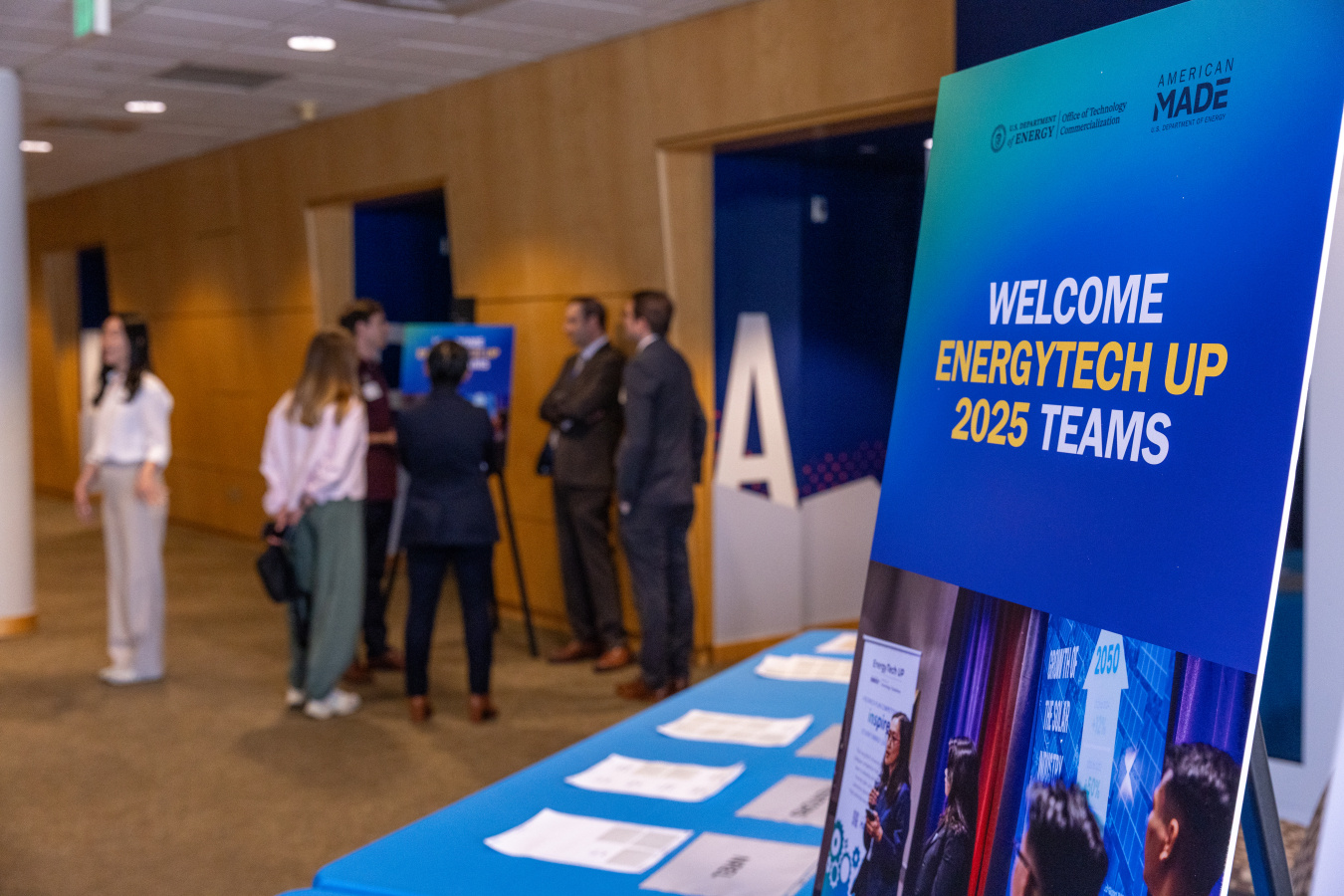 Collegiate students standing near welcome sign for the EnergyTech UP national competition