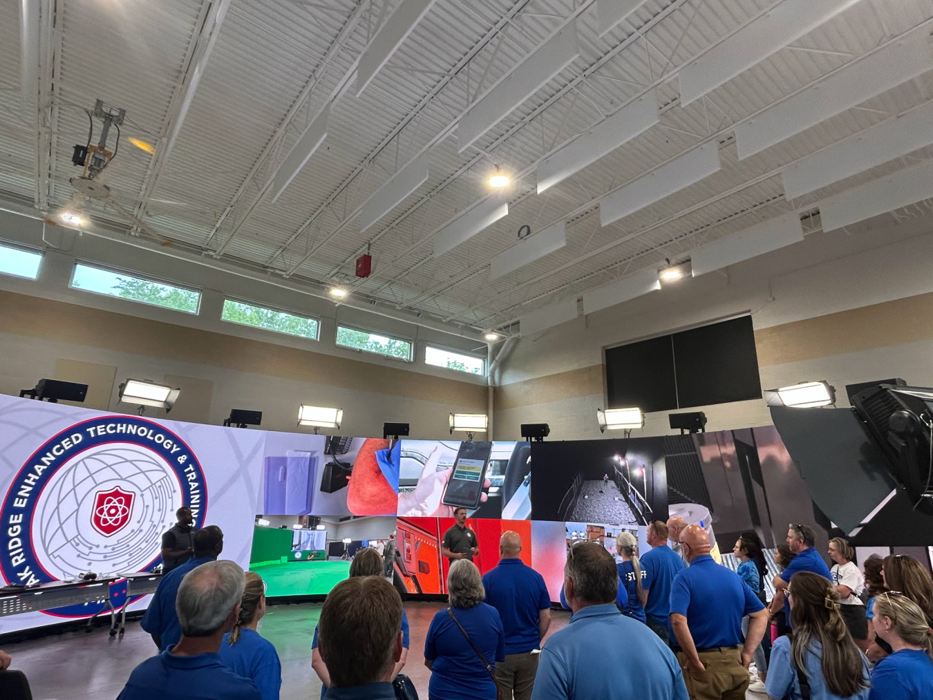 A group of educators taking a tour of a training center