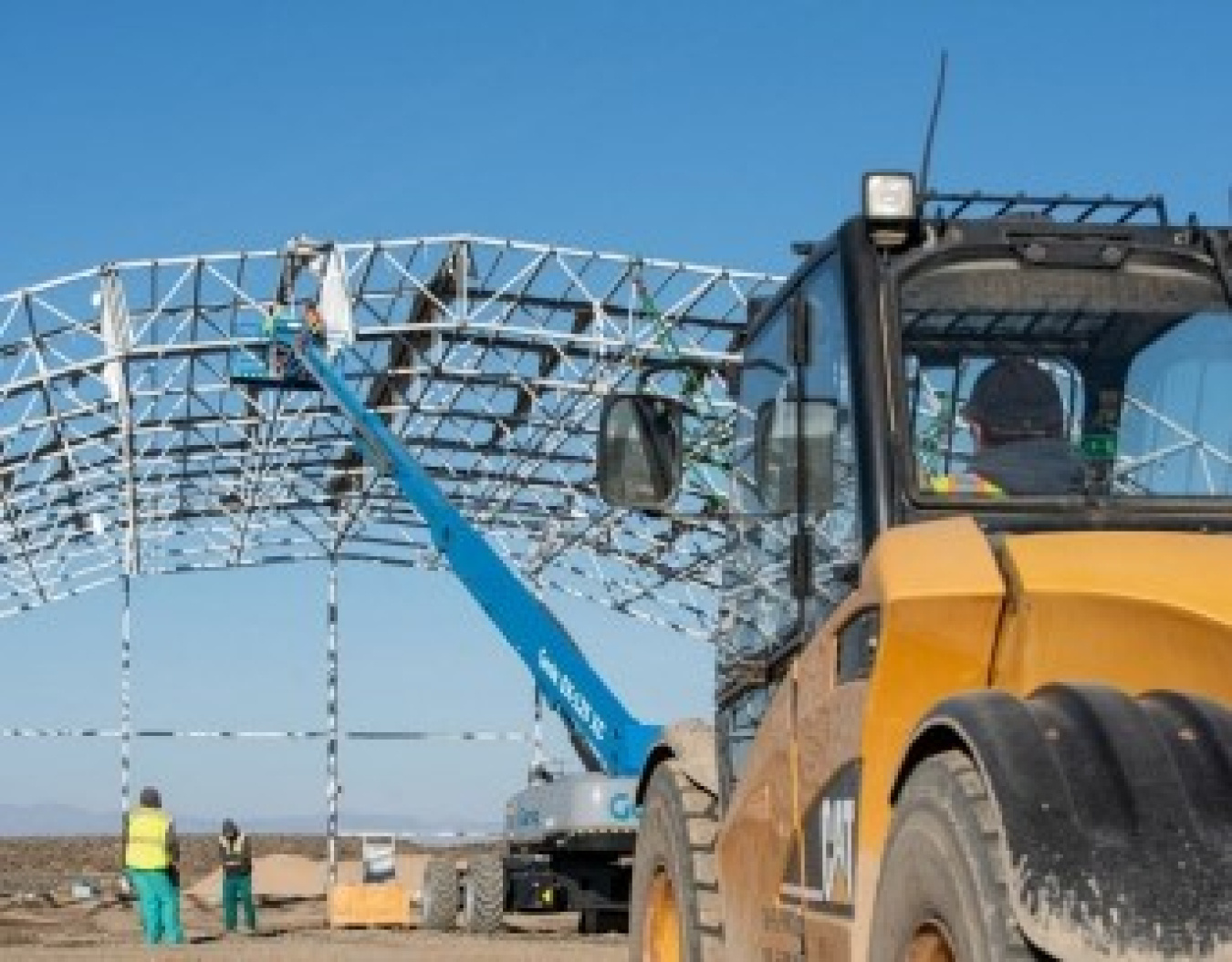 ICP demolition crews prepare to pull down a large steel enclosure