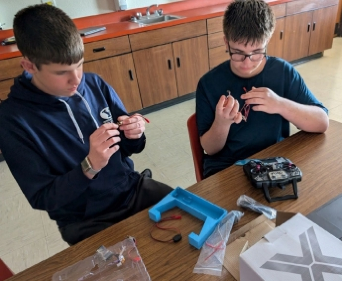 Students in Cole Hebdon’s class at Sandcreek Middle School in Ammon, Idaho, use materials bought with Idaho Environmental Coalition’s Full STEAM Ahead in the Classroom grants to make robots.
