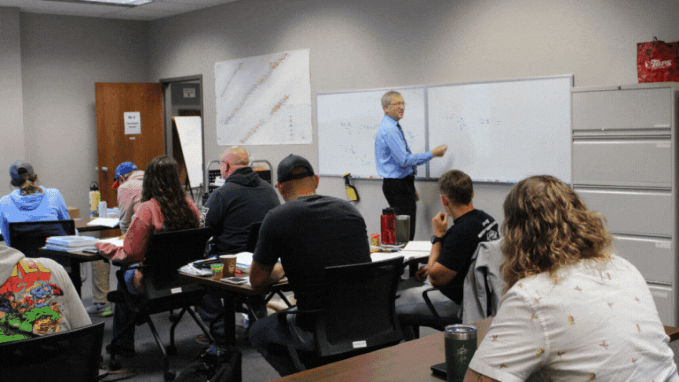 A set of rotating images of individuals participating in a technical training