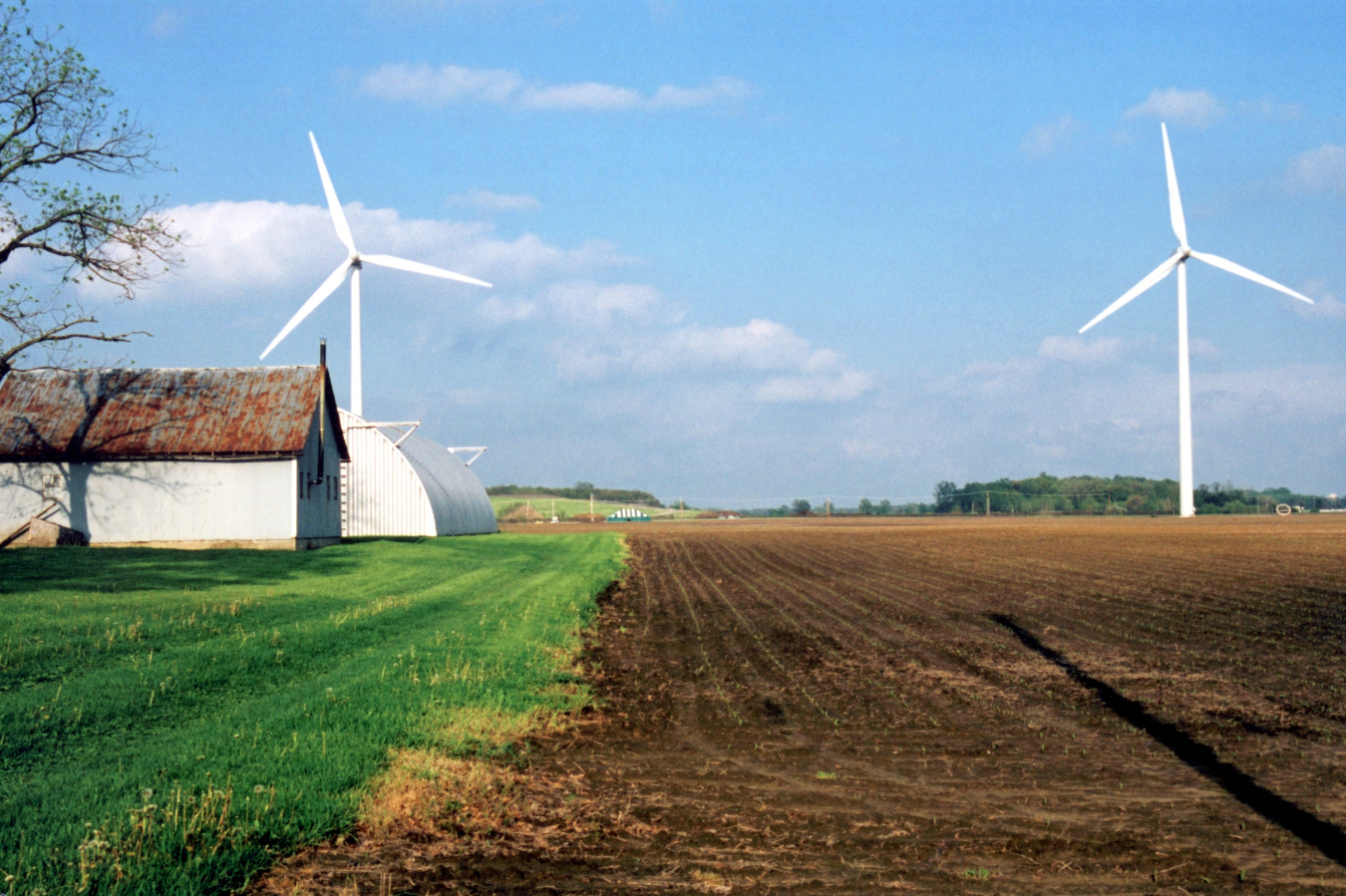 Two turbines in farmland