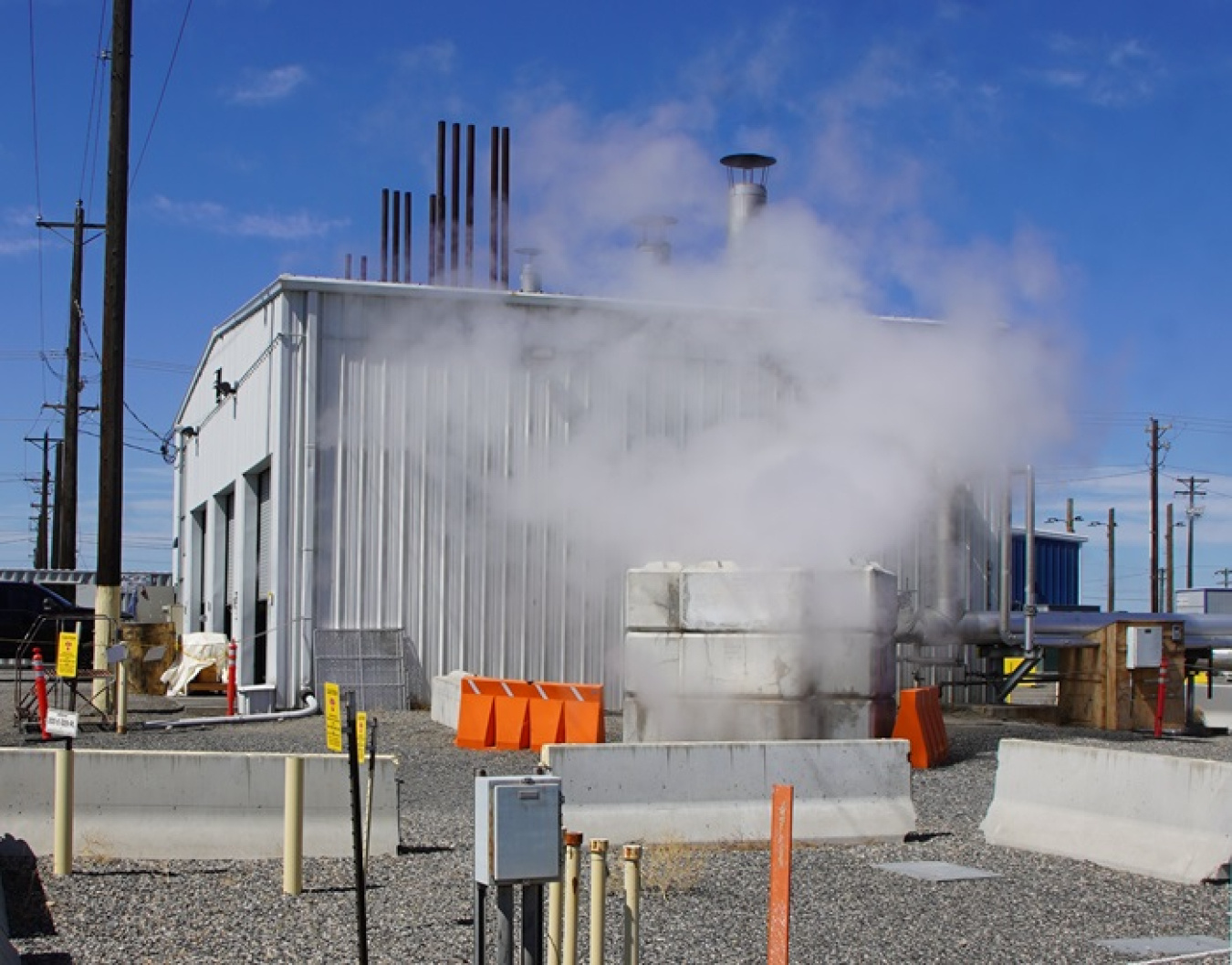 A building at the Hanford Site with steam in front of it 