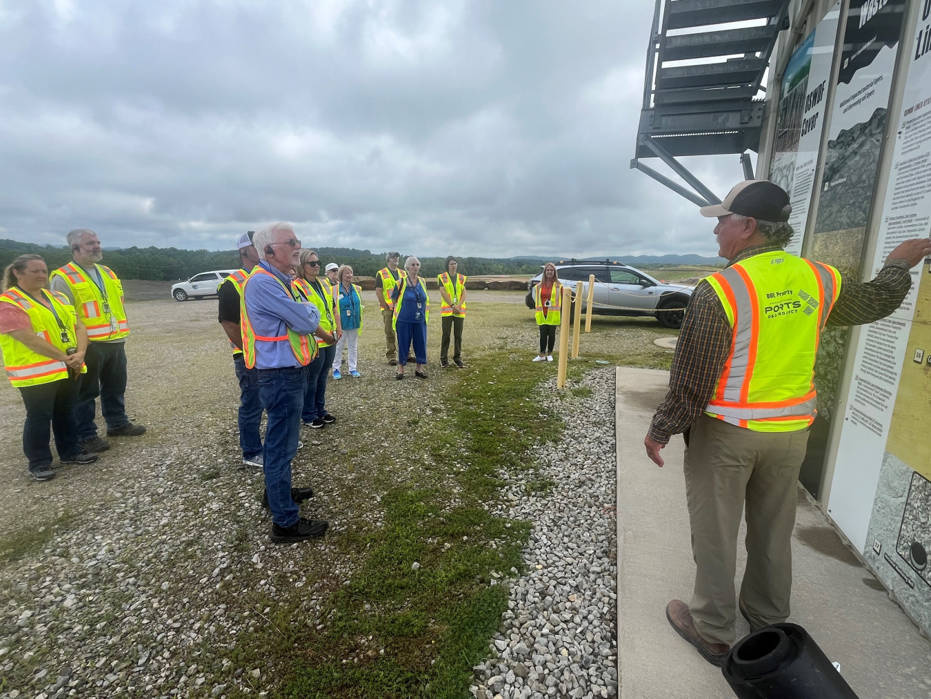 A group of people in yellow safety vests taking a tour of PPPO