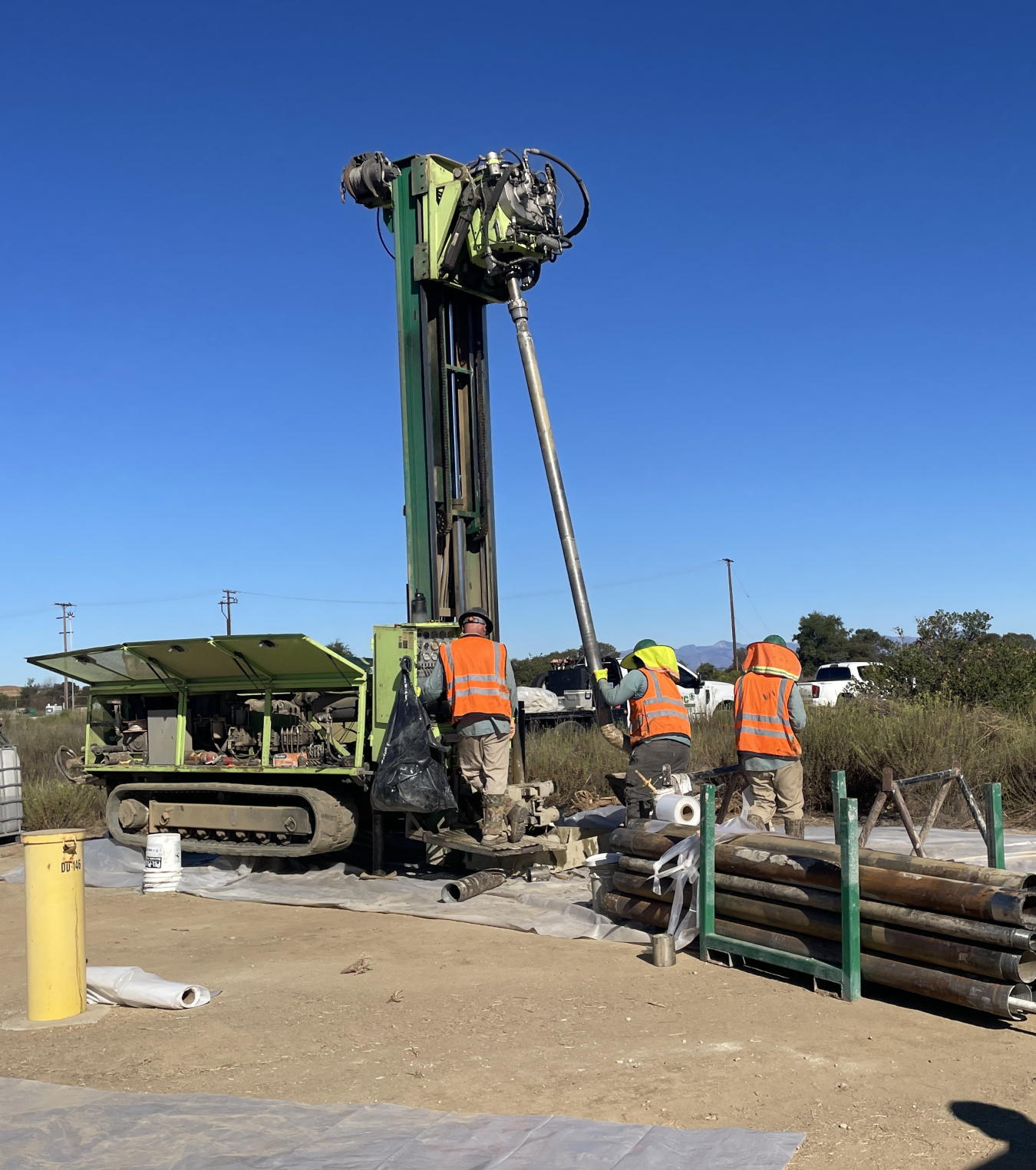 Men operating a drill rig