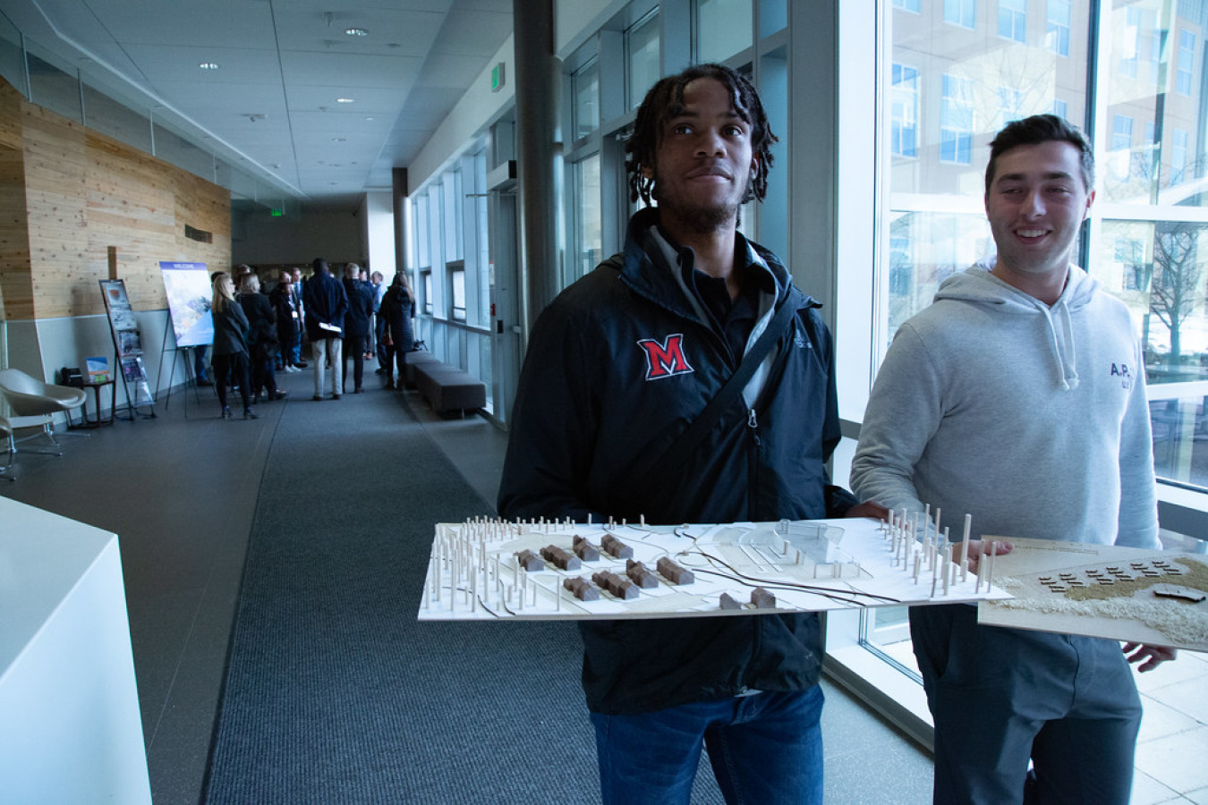 Participants holding their design models