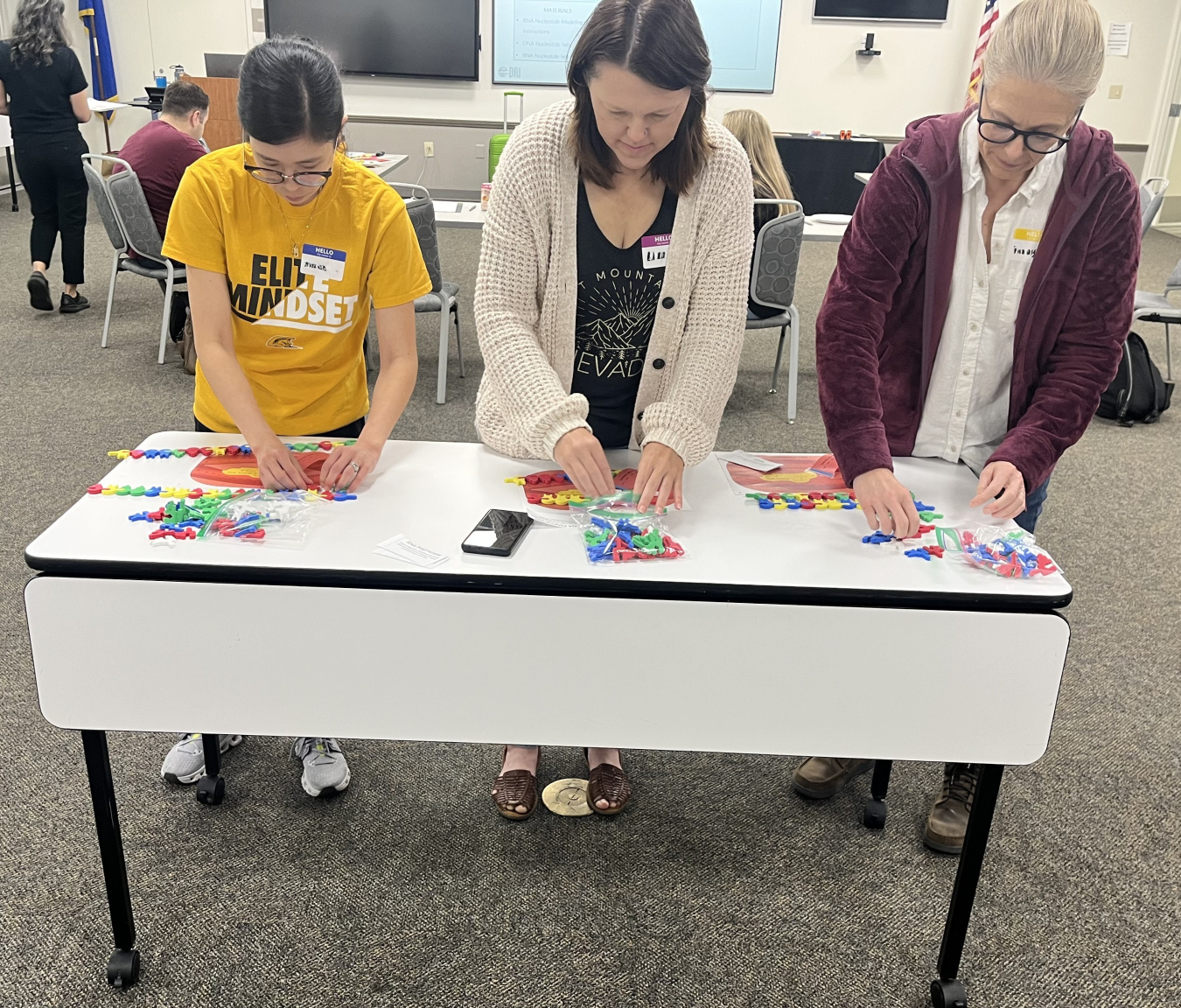 Three women participating in an educational training