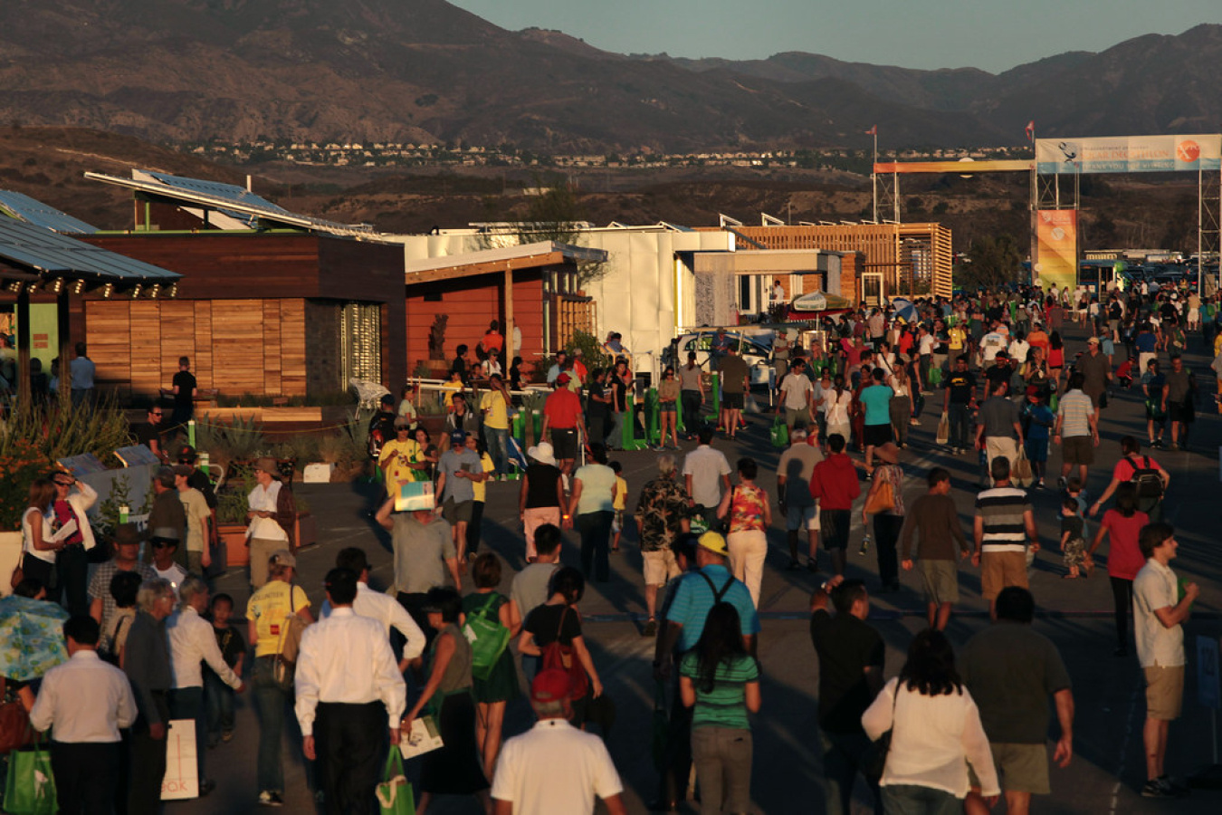 Visitors tour the 2013 village at the close of public hours at the Orange County Great Park in Irvine, Calif. 