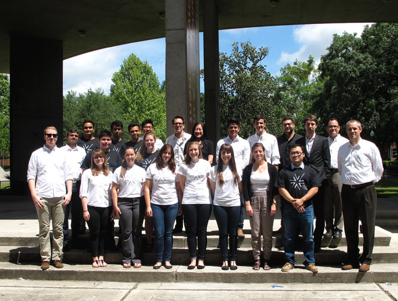 team members standing outside