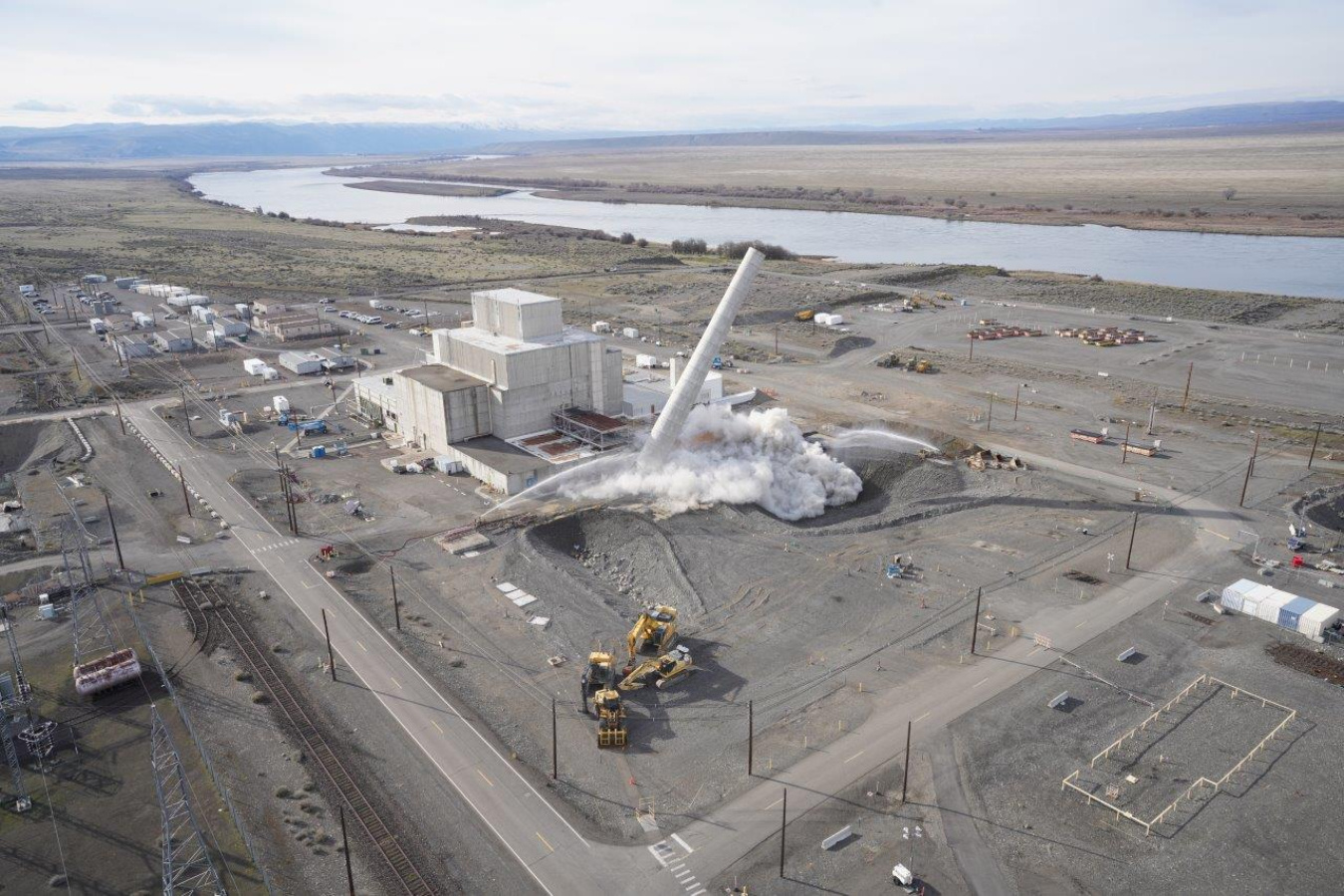 An aerial view of a stack demolition taking place at the Hanford Site