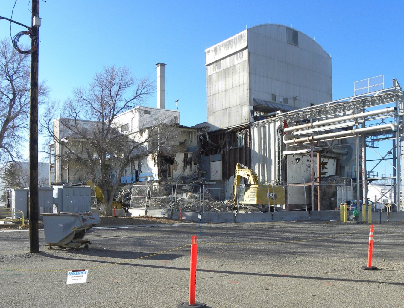 A large white building being demolished at the Idaho Site