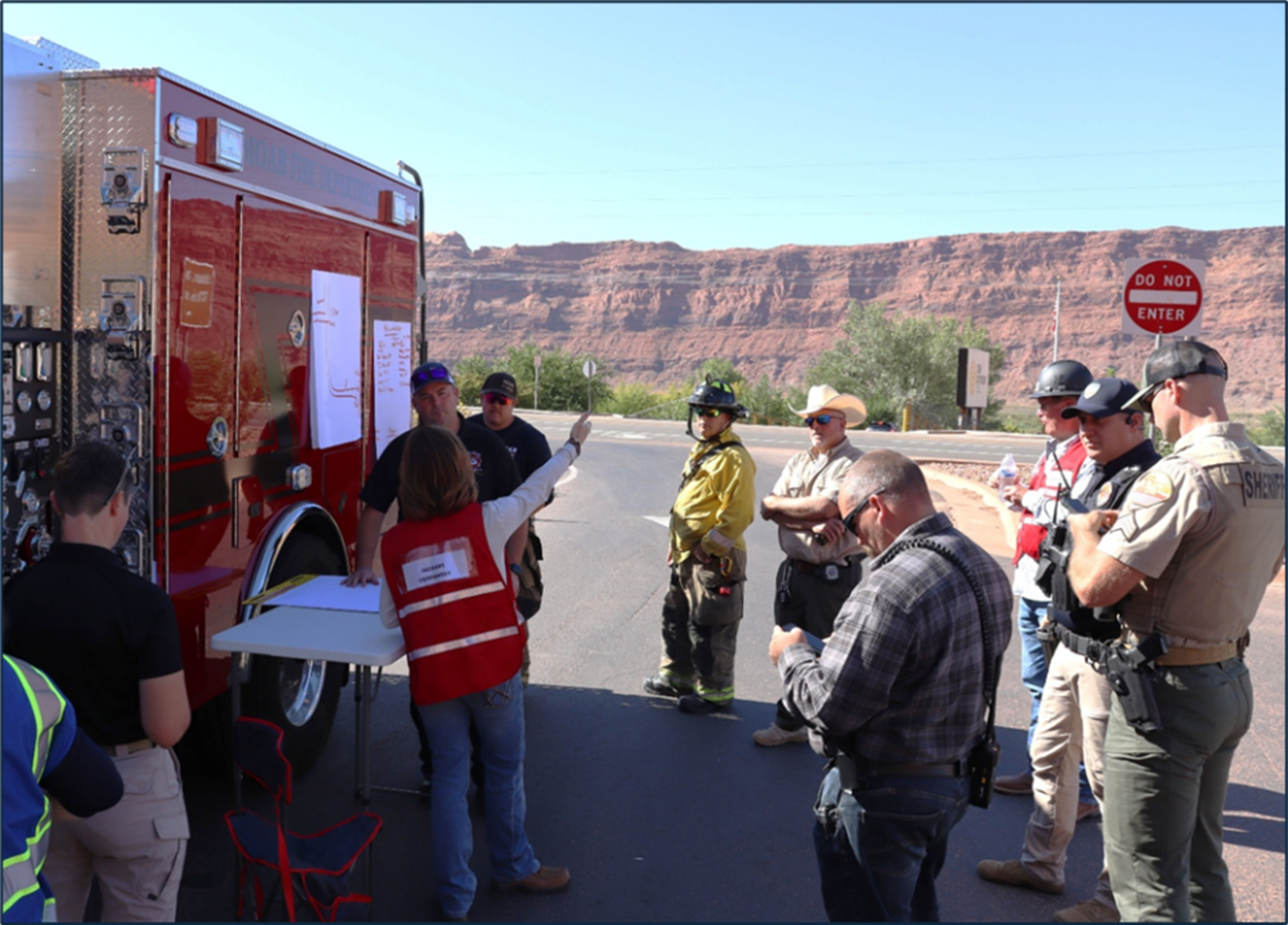 Emergency responders talking to Moab Site employees