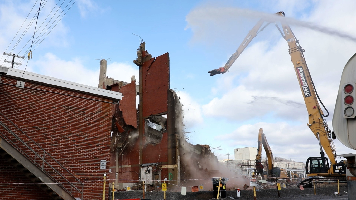 Demolition of a large brick building at the Oak Ridge Site
