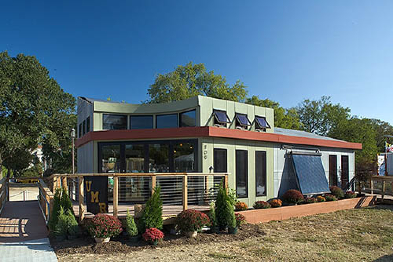 Exterior of the Missouri team's Build Challenge house, a structure having many sections and a few solar panels in the front.