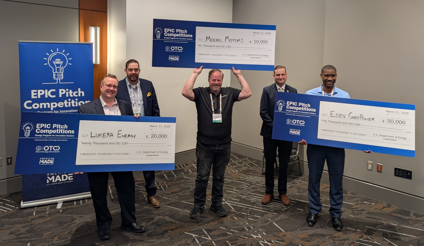 EPIC Pitch Competition winners with checks representing their awards at the TechConnect World Innovation Conference and Expo in Raleigh, NC. 