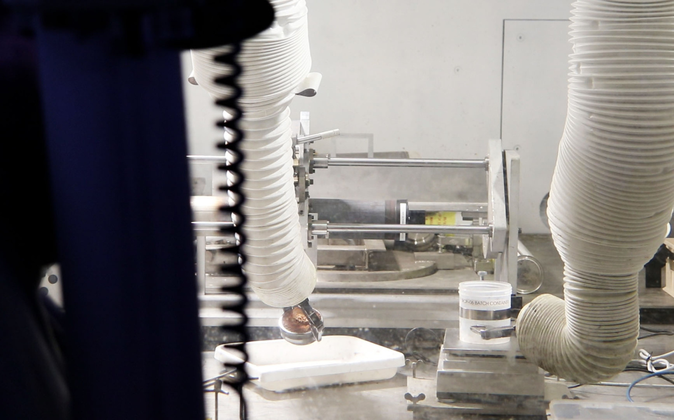 Two large white tubes inside a facility room at the Oak Ridge Site