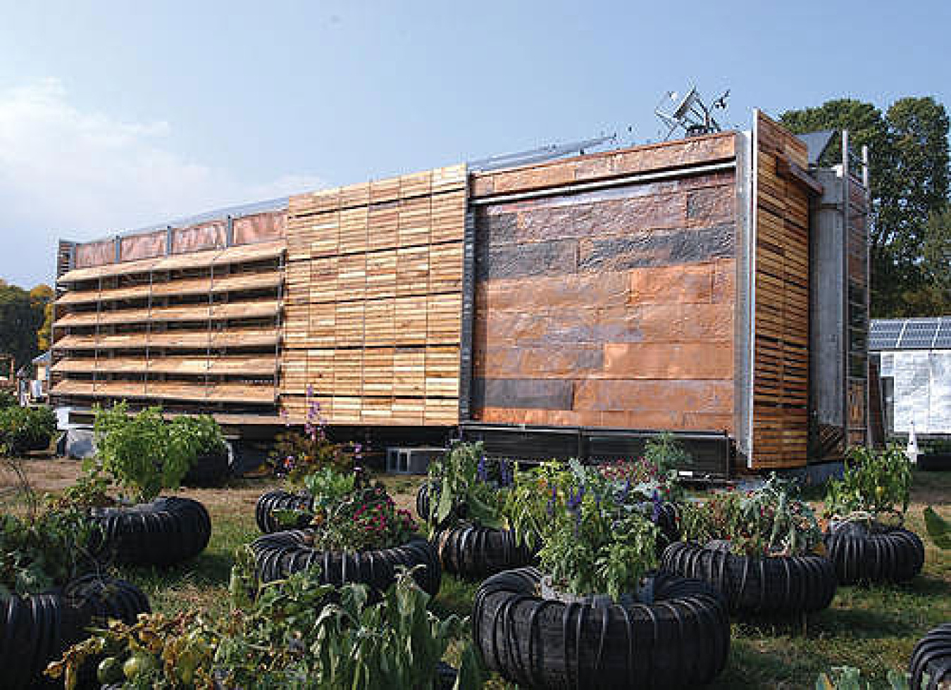The Trojan Goat incorporates recycled materials, including copper cladding reclaimed from a roof, wood panels reclaimed from shipping pallets, and paving stones reclaimed from the Rotunda at the University of Virginia.