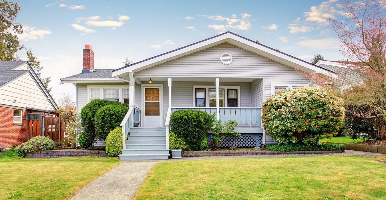 The front of a one-story home on a sunny day
