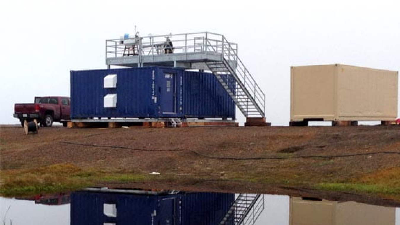 Instruments take atmospheric measurements from the roof of a new Department of Energy climate observation station at Oliktok Point, Alaska. More capabilities will be added in the coming year, including radars, lidars, and aerosol observing instrumentation.