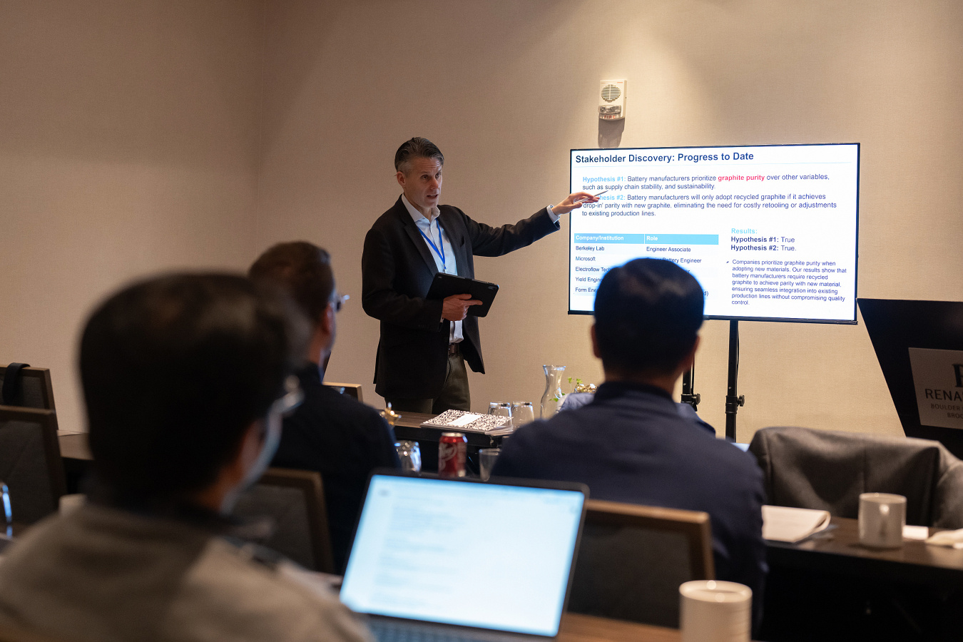 Steve Albers, Energy I-Corps coach and Co-Founder and Chief Technology Officer Living Ink Technologies, gives a presentation at the front of a room.  