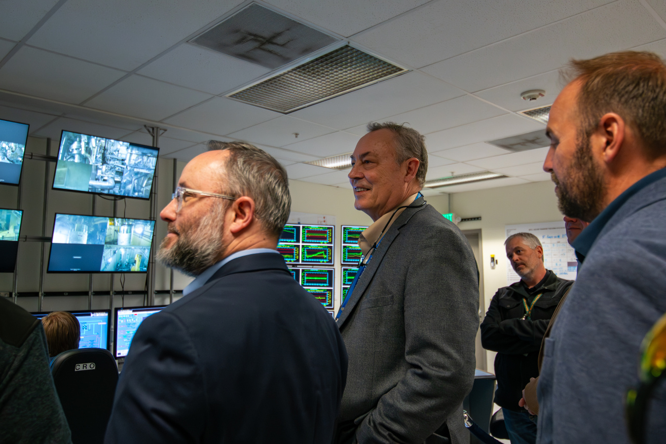 EM Leadership standing in a control room at the Idaho site