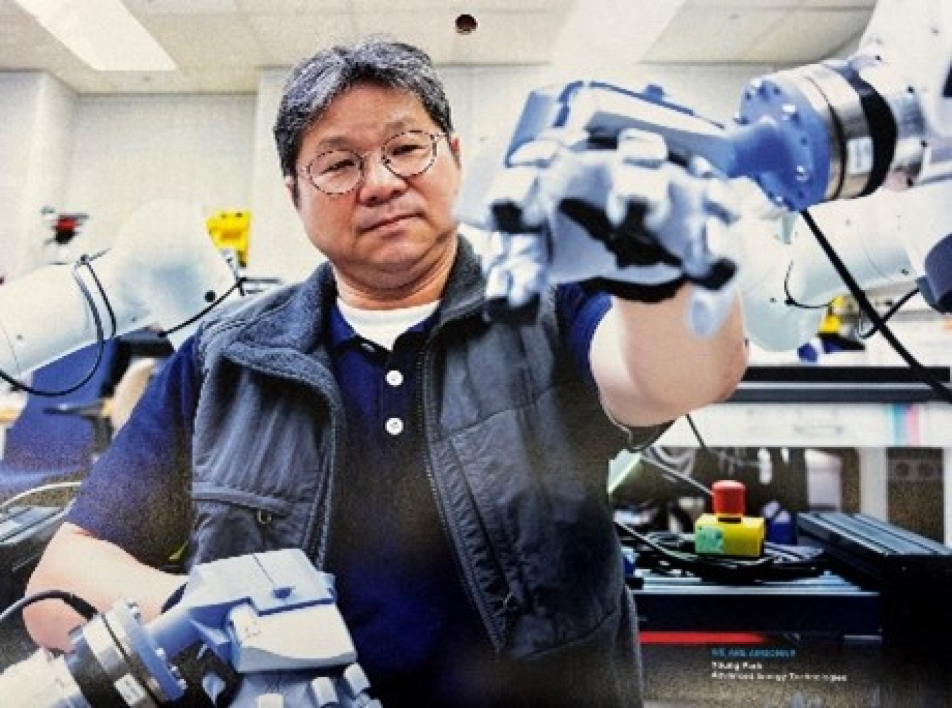 A person using robotic arms to preform work. 