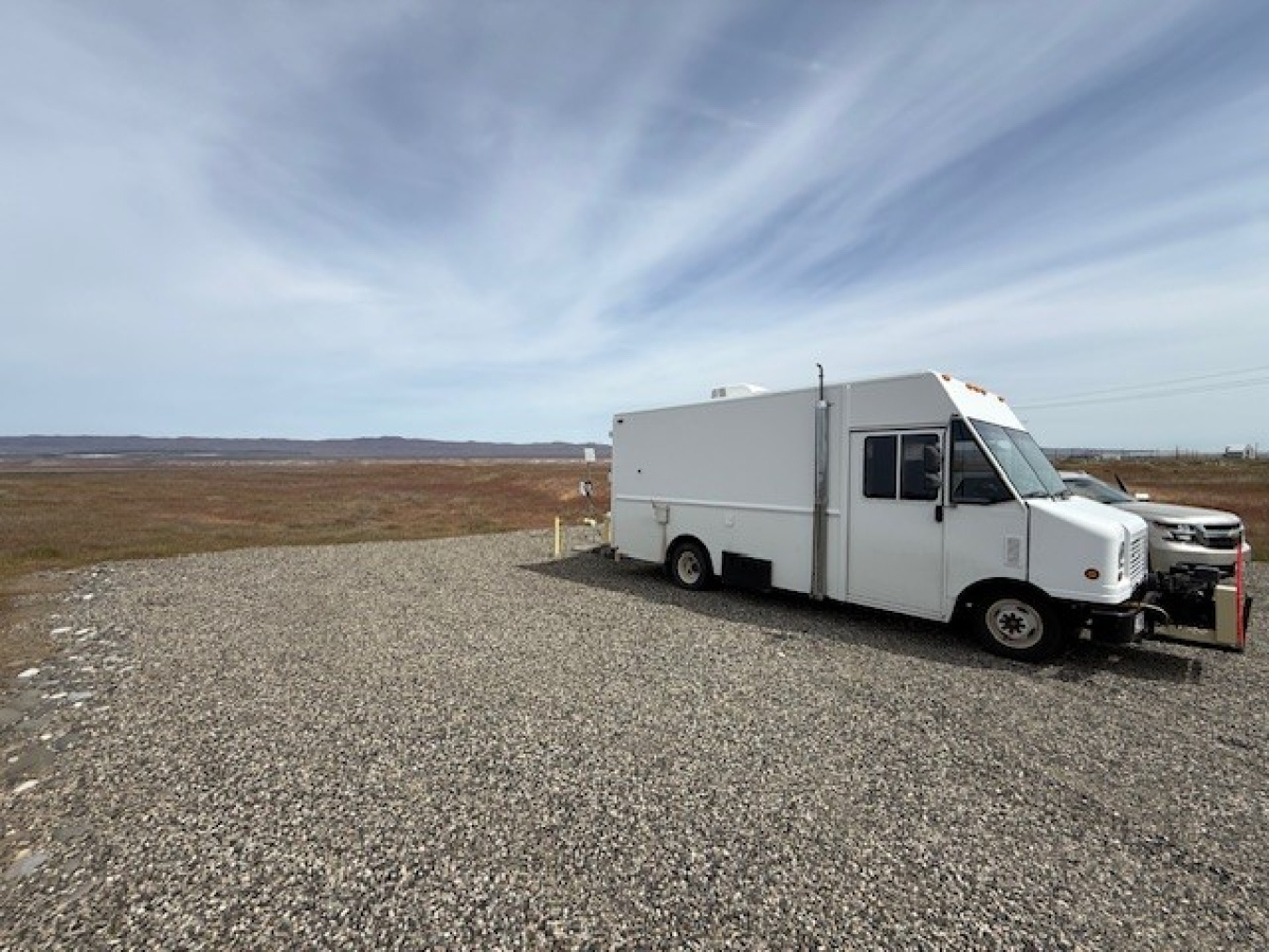 A large white sampling truck parked outside at the Hanford site