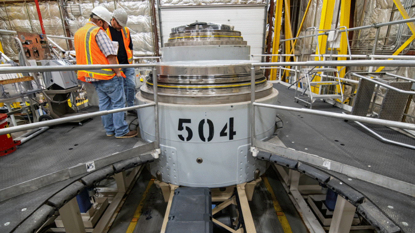 Rotating set of images of waste containers being prepared for shipment at the Idaho Site