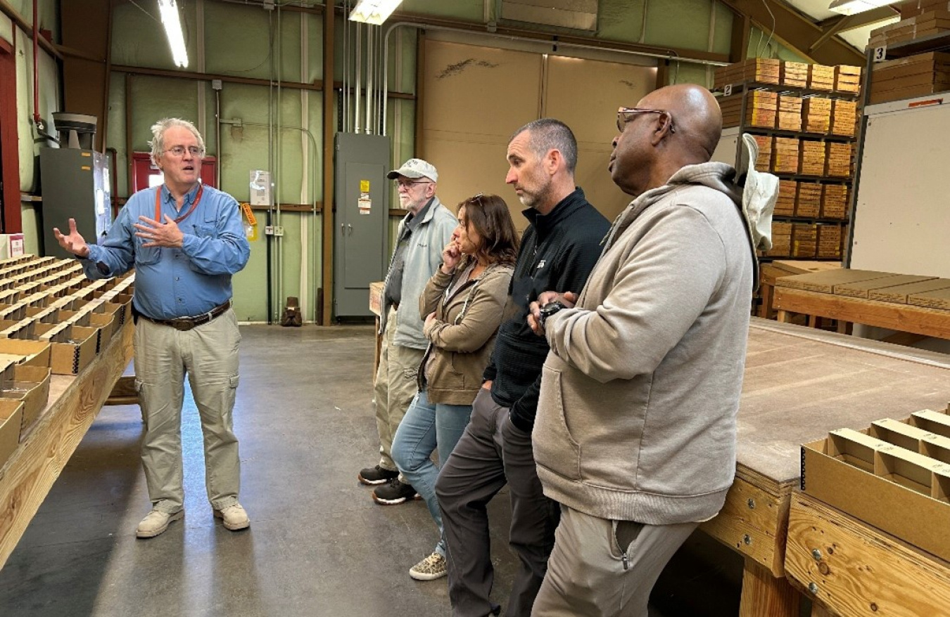 A group of people taking a tour of a facility building at the Nevada Site