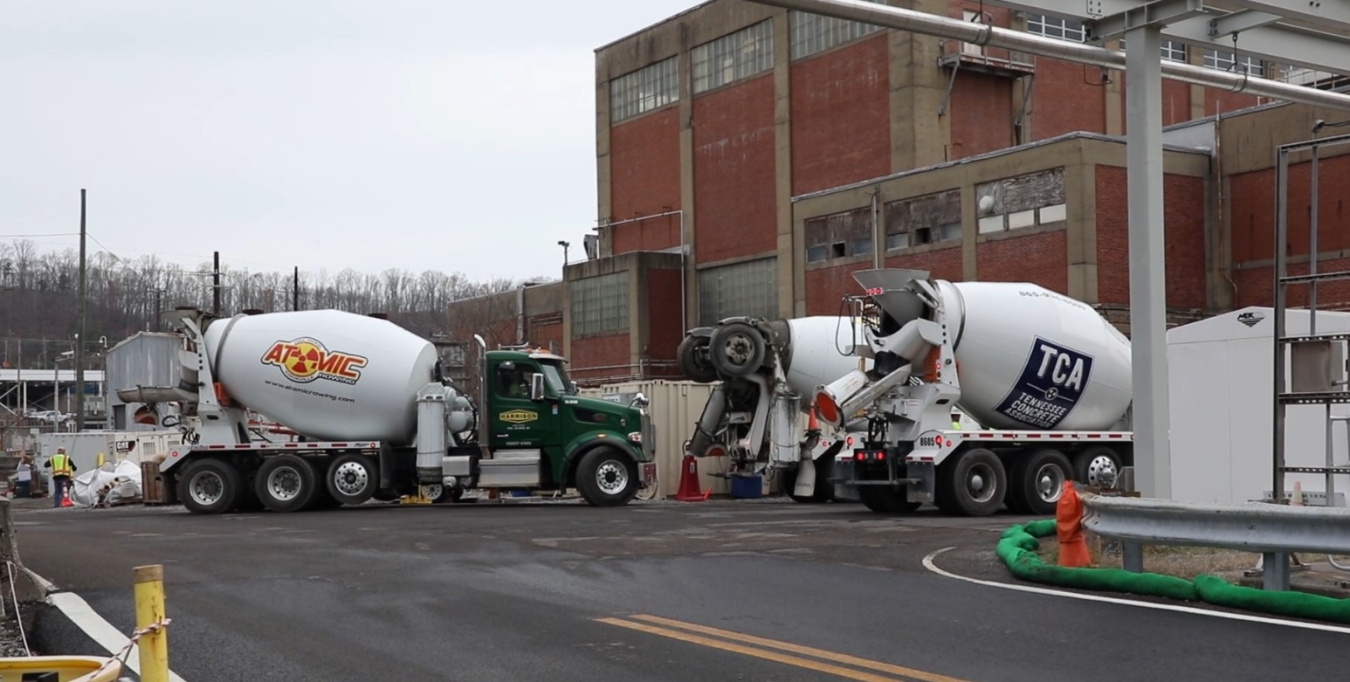 Two concrete mixer trucks at the Oak Ridge site