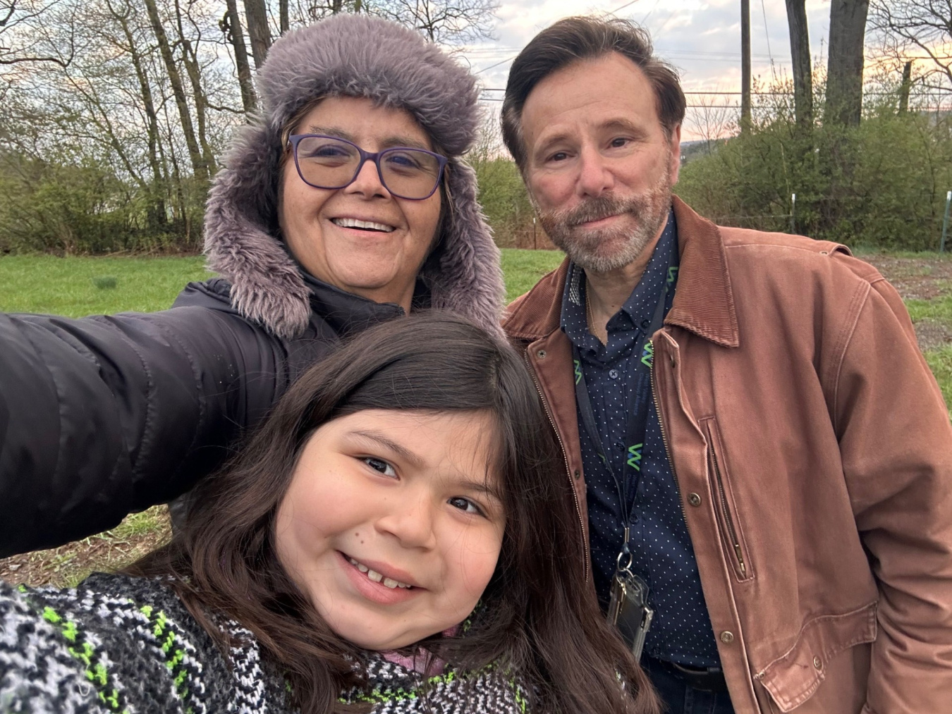 A selfie of a man, woman, and a girl outside at the Paducah site